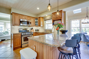 Lumberton Township house for rent - A kitchen with wooden cabinets and a granite countertop.