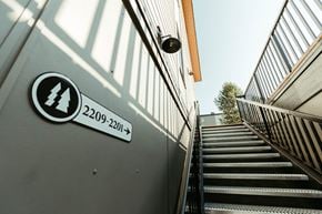 Revelstoke apartment for rent - A staircase with a sign that says 2209-2201 on it.