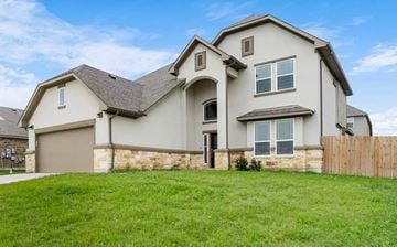 Killeen house for rent - A large, two-story house with a garage and a fence in front.