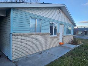 Nampa apartment for rent - A blue house with a white door and windows.