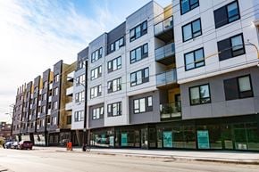 Halifax apartment for rent - A modern multi-story building with balconies and glass doors.