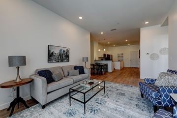 East Providence apartment for rent - A living room with a grey couch and a coffee table.