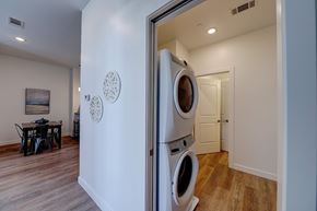 East Providence apartment for rent - A washer and dryer are stacked in a small room.