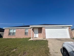 Killeen house for rent - A house with a garage and a car parked in front.