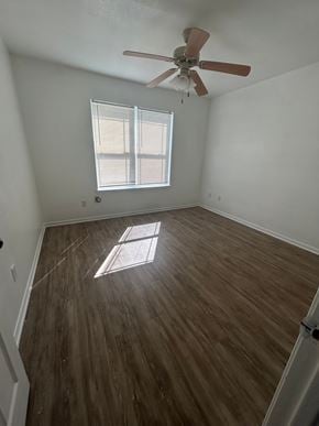Killeen house for rent - A room with a ceiling fan and a window letting in sunlight.