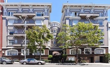 San Francisco apartment for rent - A car is parked in front of a building with the number 1060 on it.
