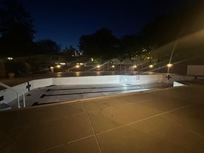 Washington apartment for rent - A parking lot at night with lights on.