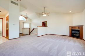 Coralville house for rent - A wooden swing set with a green slide in a grassy backyard.