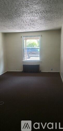 Pittsburgh house for rent - A room with a window and a radiator on the wall.