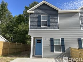 Fayetteville house for rent - A house with a blue door and a grey facade is numbered 9254.