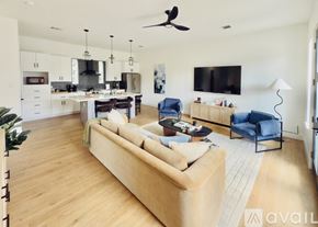 Houston house for rent - A modern house with a front yard and a driveway.