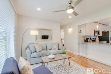 Nashville house for rent - A living room with a grey couch and a coffee table.