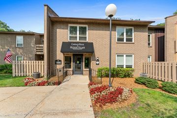 Muskegon apartment for rent - The image shows a building with a sign that reads "Covenant House Inc. Hygge House."