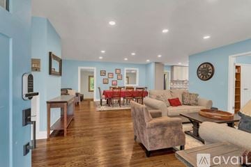 Murfreesboro house for rent - A dining room with a wooden table and chairs.