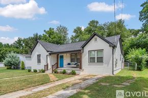 Murfreesboro house for rent - A bedroom with a bed, nightstands, and a wooden floor.