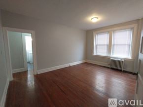 Baltimore apartment for rent - A kitchen with a stove, sink, and window.
