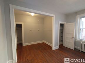 Baltimore apartment for rent - A kitchen with a stove, sink, and refrigerator.