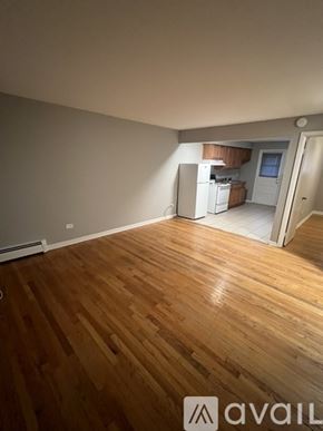 Worth apartment for rent - A room with wooden flooring and a window.