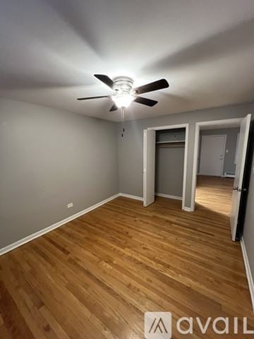 Worth apartment for rent - A kitchen with wooden cabinets and a white fridge.