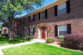 Toledo apartment for rent - the front of a brick house with a red door