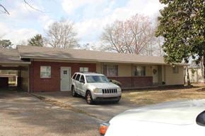 Hattiesburg apartment for rent - A white car is parked in front of a house.