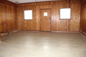 Hattiesburg apartment for rent - A room with wooden walls and a wooden door.