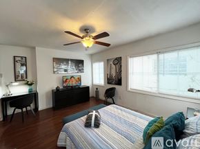 Miami apartment for rent - A bedroom with a bed, desk, and chair.
