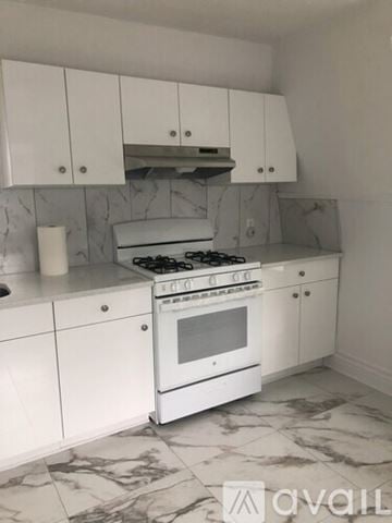 Summit apartment for rent - A kitchen with a white stove and cabinets.