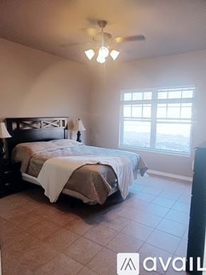 Three Rivers townhouse for rent - A bedroom with a bed and a window.