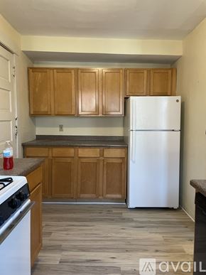Madison apartment for rent - A bedroom with a bed, dresser, and window with blinds.