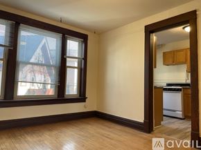 Madison apartment for rent - A kitchen with brown cabinets and a white dishwasher.