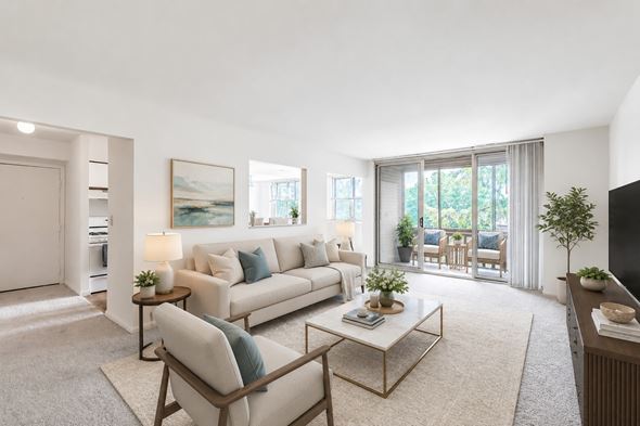 Scranton apartment for rent - A living room with a white sofa, a coffee table, and a painting on the wall.