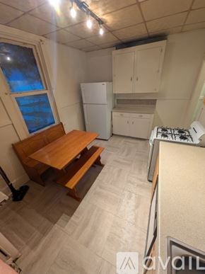 Johnstown townhouse for rent - A room with a wooden floor and a ceiling fan.