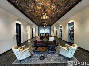 Chicago apartment for rent - A large building with a parking lot in front of it.