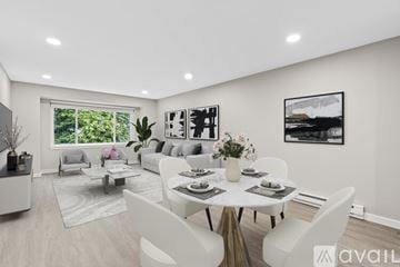 Edmonds apartment for rent - A modern dining room with a large table set for six.