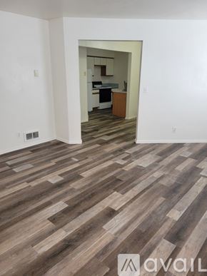 Idaho Falls apartment for rent - A room with wooden flooring and a mirror on the wall.