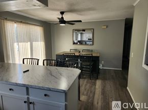 Mesick apartment for rent - A kitchen with a marble countertop and a ceiling fan.