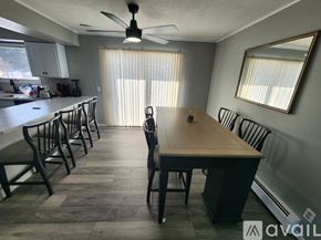 Mesick apartment for rent - A dining room with a wooden table and chairs.