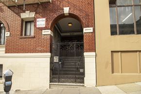 San Francisco apartment for rent - A black gate with a sign above it that says "No Parking".