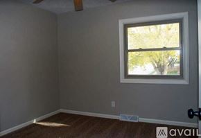Omaha house for rent - A room with a window and a door.