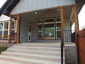 Granite Shoals house for rent - A house with a white door and black railings.