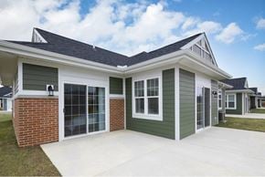 Canton apartment for rent - A house with a green exterior and a grey roof.