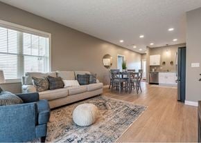 Canton apartment for rent - A living room with a couch, chairs, and a rug.