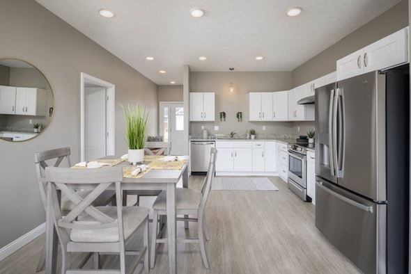 Canton apartment for rent - A modern kitchen with a dining table set for two.