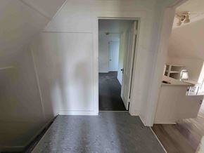 New Glasgow apartment for rent - A room with a doorway leading to another room.