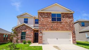 Forney house for rent - A two-story house with a garage door and a brick facade.