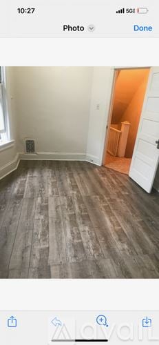 Trenton apartment for rent - A room with wooden flooring and a white door.