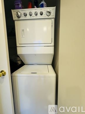 Tucson townhouse for rent - A white dishwasher and oven are stacked on top of each other.