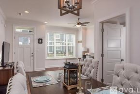Chattanooga house for rent - A dining room with a wooden table set for two.