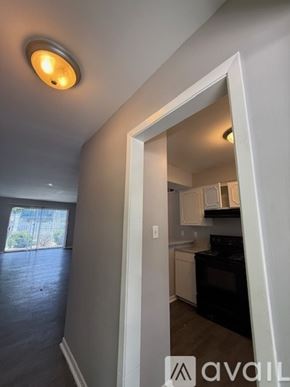 Bryan apartment for rent - A kitchen area with a black oven and white cabinets.